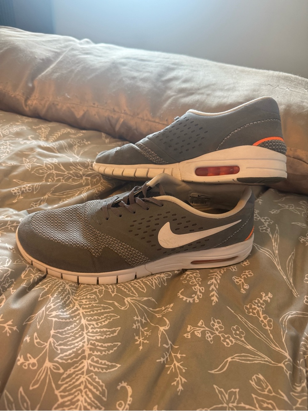 Nike Men’s Gray Athletic Shoes with White Swoosh and Orange Accents